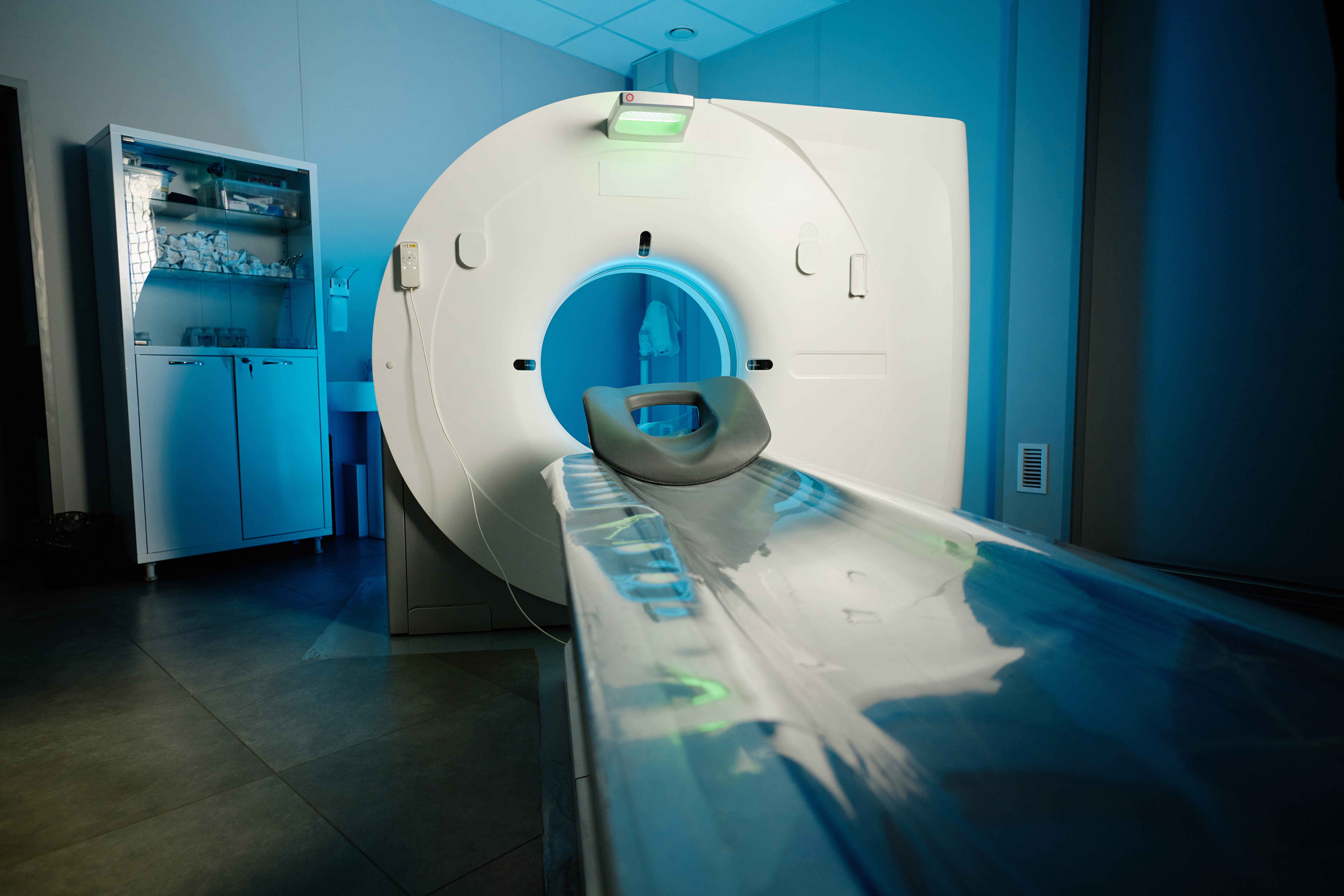 No people wide shot of modern CT scanner in hospital, copy space